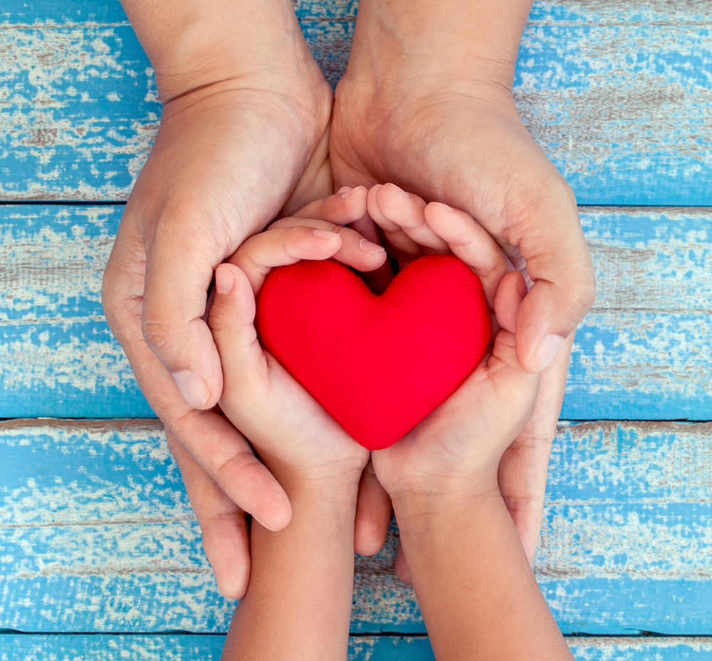 event information, two pairs of hands holding a red heart
