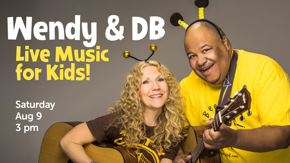 portrait of smiling woman and man with guitars, with event info text