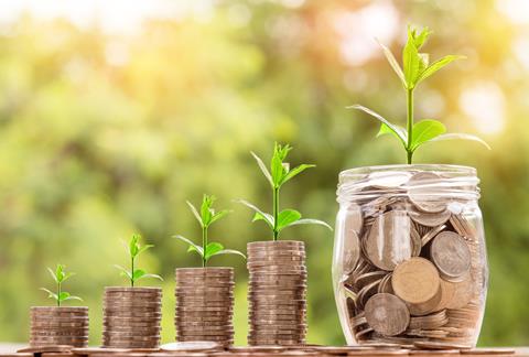 stacks of coins, increasing size, sprouts growing out top