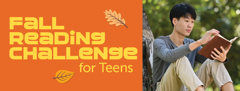 teenager sits by tree reading
