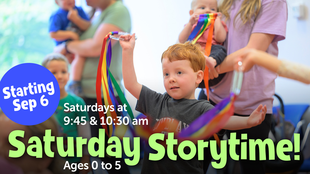 young boy at a storytime where they are using props, event info text